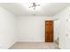 Light-filled bedroom featuring neutral carpet and a modern ceiling light fixture at 212 Heidinger Dr, Cary, NC 27511