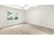 Bright, airy bedroom with neutral carpet and a view of lush greenery at 212 Heidinger Dr, Cary, NC 27511