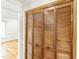 Hall closet with louvered doors and hardwood floors at 212 Heidinger Dr, Cary, NC 27511