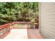 A wooden deck showcases a natural wood railing and an expansive view of the backyard at 212 Heidinger Dr, Cary, NC 27511
