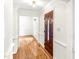 Bright entryway with hardwood floors and a dark wood front door at 212 Heidinger Dr, Cary, NC 27511