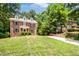 Classic brick home with dormers, a large front yard and private driveway at 212 Heidinger Dr, Cary, NC 27511