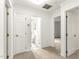 Hallway with neutral carpet, crisp white trim, and easy access to rooms at 212 Heidinger Dr, Cary, NC 27511