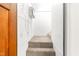 Hallway and staircase with beige carpet and white walls at 212 Heidinger Dr, Cary, NC 27511
