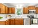 Beautifully updated kitchen featuring stainless steel appliances, wood cabinets, and white countertops at 212 Heidinger Dr, Cary, NC 27511