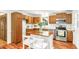 Well-equipped kitchen with wood cabinets, stainless appliances, and island offers style and convenience at 212 Heidinger Dr, Cary, NC 27511