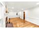 Bright living room features hardwood floors, a fireplace, and crisp white walls at 212 Heidinger Dr, Cary, NC 27511