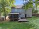 Two-story home with backyard patio, deck, and well-maintained lawn at 2205 Bufflehead Rd, Raleigh, NC 27616