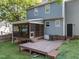 Home features a covered patio, wood deck, and spacious green lawn at 2205 Bufflehead Rd, Raleigh, NC 27616