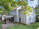 Home featuring screened-in porch, deck, green lawn and back entrance at 2205 Bufflehead Rd, Raleigh, NC 27616
