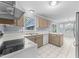 Bright kitchen showcases a window view to the screened porch at 2205 Bufflehead Rd, Raleigh, NC 27616