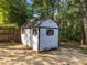 A weathered outbuilding with small windows and a fenced perimeter at 2205 Bufflehead Rd, Raleigh, NC 27616