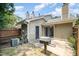 This backyard features a patio and grill, with an AC unit and privacy fence at 2213 Alpine Rd, Durham, NC 27707