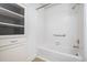 This bathroom features a shower and tub combination with a built-in wall storage unit at 2213 Alpine Rd, Durham, NC 27707