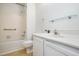 A bright bathroom featuring a tiled shower and tub combination at 2213 Alpine Rd, Durham, NC 27707