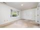 Spacious bedroom features neutral carpet, a large window, and double closets at 2213 Alpine Rd, Durham, NC 27707