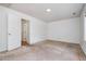 This bedroom features neutral carpet, an overhead light, and easy access to the hallway at 2213 Alpine Rd, Durham, NC 27707