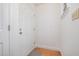 Bright entryway featuring a white door, hardwood floors, and classic trim at 2213 Alpine Rd, Durham, NC 27707