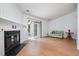 Cozy living room with a fireplace, sliding glass doors, and neutral decor at 2213 Alpine Rd, Durham, NC 27707