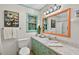 Light filled bathroom with a tub and shower combo, and unique fixtures at 224 Fleming Dr, Durham, NC 27712