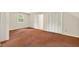 Spacious bedroom with neutral walls and carpeted floors, and a closet in the corner at 224 Fleming Dr, Durham, NC 27712