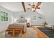 Cozy bedroom with hardwood floors, exposed wood beams, and a comfortable king bed at 224 Fleming Dr, Durham, NC 27712