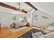 Vaulted bedroom with hardwood floors, exposed beams, and a comfortable king bed at 224 Fleming Dr, Durham, NC 27712