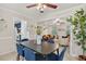 Cozy dining room featuring neutral tones, a ceiling fan, and a view into the adjacent living room at 224 Fleming Dr, Durham, NC 27712