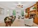 Bright living room with a fireplace, built-in shelving, large windows, and a comfortable seating arrangement at 224 Fleming Dr, Durham, NC 27712