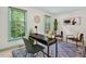 Home office features large windows, natural light, modern decor and an accent rug at 224 Fleming Dr, Durham, NC 27712