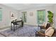 Comfortable office featuring large windows, a stylish rug, and neutral walls at 224 Fleming Dr, Durham, NC 27712