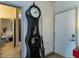Hallway view showing a decorative clock and doorway to a bedroom at 2317 Gathering Square Ct, Fuquay Varina, NC 27526