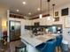 Modern kitchen features white cabinets, stainless steel appliances, granite countertops, and pendant lighting at 2317 Gathering Square Ct, Fuquay Varina, NC 27526