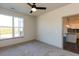 Bedroom with large window and view to the kitchen at 2323 Gathering Sq Ct, Fuquay Varina, NC 27526