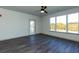 Bedroom with large windows and a balcony door provides lots of natural light at 2323 Gathering Sq Ct, Fuquay Varina, NC 27526