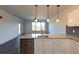 Open-concept kitchen boasts granite countertops, stainless appliances, and a view to living space at 2323 Gathering Sq Ct, Fuquay Varina, NC 27526