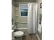 Bathroom featuring a shower-tub combination with shower curtain and tile floors at 2331 Kennington Rd, Raleigh, NC 27610