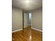 Bedroom with hardwood floors and neutral wall color at 2331 Kennington Rd, Raleigh, NC 27610