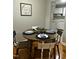 Charming dining area with hardwood floors and seating for four is located right off the kitchen at 2331 Kennington Rd, Raleigh, NC 27610