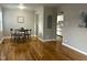 Inviting living room with hardwood floors, neutral walls, and seamless flow into the dining area and kitchen at 2331 Kennington Rd, Raleigh, NC 27610