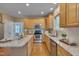 Bright kitchen featuring stainless steel appliances, granite counters, and an eat-in island at 2420 Rogerson St, Raleigh, NC 27614