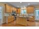 Well-equipped kitchen with stainless steel appliances, granite countertops, and custom wood cabinets at 2420 Rogerson St, Raleigh, NC 27614