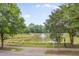 Community walking trail with a pond and fountain feature for scenic views and peaceful walks at 2420 Rogerson St, Raleigh, NC 27614