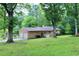Backyard featuring a brick home with a two-car garage at 2440 Gardner Holt Rd, Burlington, NC 27215