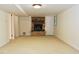 Basement with brick fireplace, neutral carpet, and ample space at 2440 Gardner Holt Rd, Burlington, NC 27215