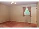 Bedroom with pink carpet, decorative wallpaper, a window with curtains, and a white door at 2440 Gardner Holt Rd, Burlington, NC 27215