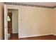 Bedroom boasting hardwood floors, decorative wallpaper and doorway to other rooms in the home at 2440 Gardner Holt Rd, Burlington, NC 27215