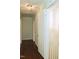 Hallway features hardwood floors, neutral walls, crown moulding, and doors leading to various rooms at 2440 Gardner Holt Rd, Burlington, NC 27215