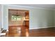 Spacious living room leading to a dining area with hardwood floors and ample natural light at 2440 Gardner Holt Rd, Burlington, NC 27215