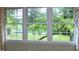 Picturesque view from a window overlooking a lush green lawn and tranquil lake at 2440 Gardner Holt Rd, Burlington, NC 27215